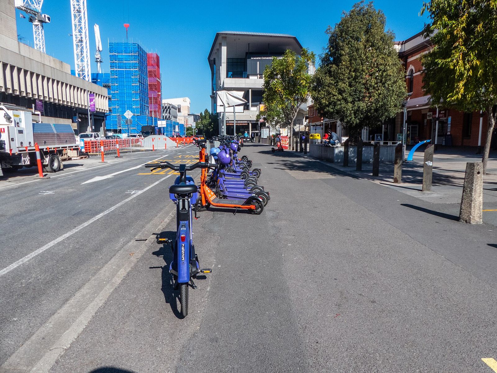 Shared e-scooters and e-bikes outside South Brisbane railway station